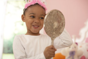 Young Girl Playing By Herself