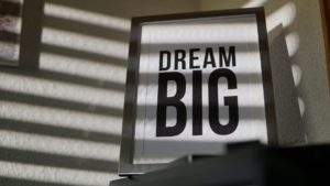 a photo in a frame that reads "DREAM BIG"